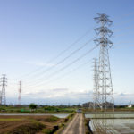 鉄塔と水田のある風景　～田植えの季節～